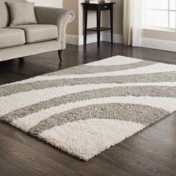 Brand new rug with plastic covering. 

Perfect for living room or bedroom

100% heat set polypropylene pile.

Dimensions: 110 X 160cm 
Colour: beige & White