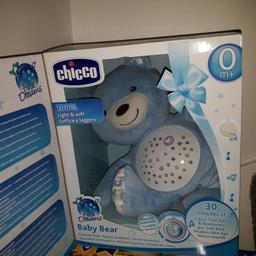 Blue projector bear.plays lullabies and has light up belly. Hardly used in perfect condition in box