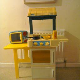 Fisher Price Kitchen with oven, microwave and sink. Included - sundry kitchen items and mini food items etc.