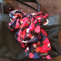 Genuine DKNY bag and scarf. 
Used but still have a lot of life left in it. 
I have other bags and not using this one anymore.
There is some use on the handles but it is still in very good condition. 
From a smoke and pet free home.