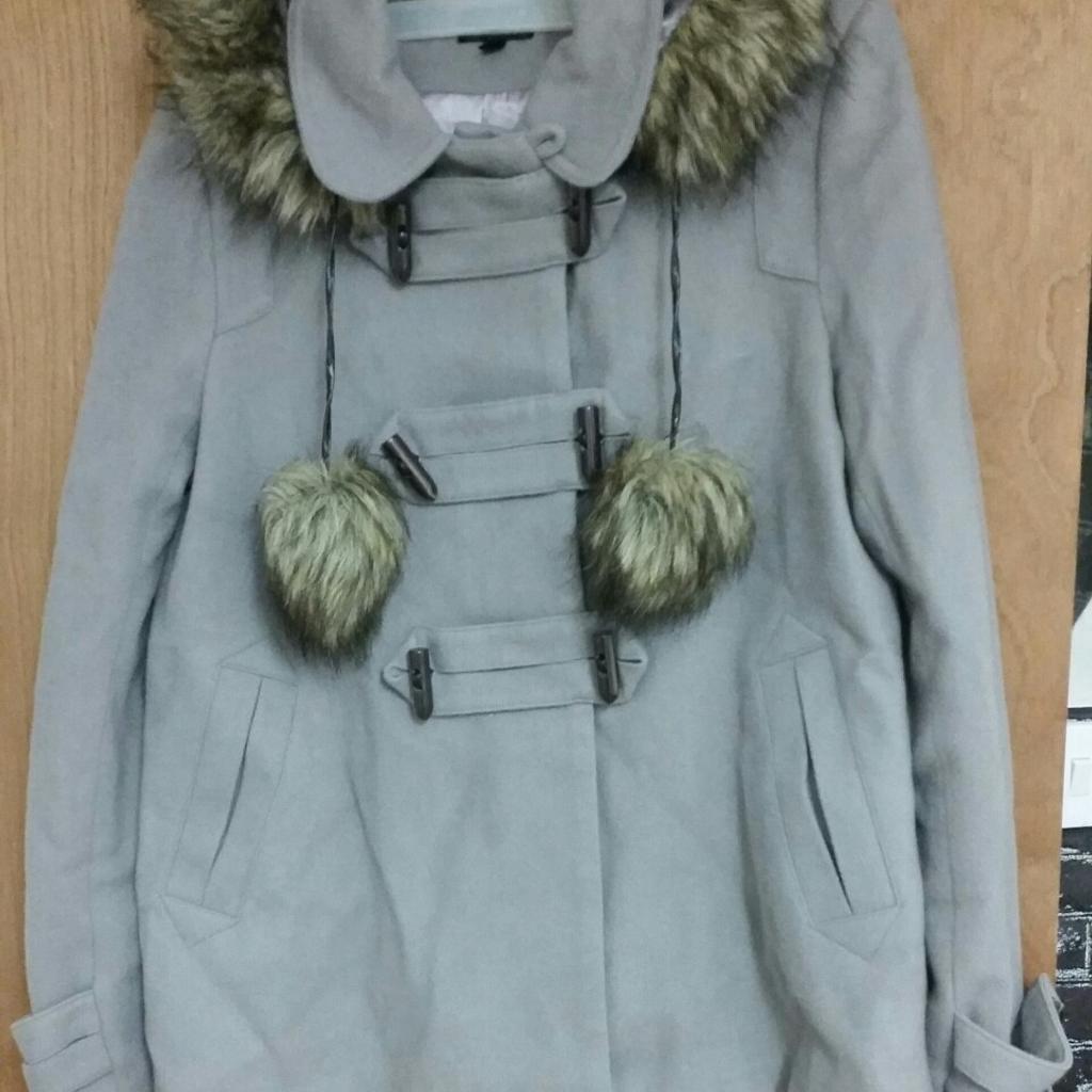 Coat with hood size 16 in good condition it never been worn