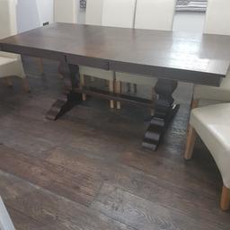 Georgeous dark wood brand new dining table Extended full length 200cm width 91cm. Having to sell due to my dining room size.. it's assembled and can be dismantled. Please note collection only. Table just over 30 days therefore unable to return. Immaculate condition. £425 only. Seats 8 people fully extended.