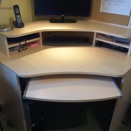 Beech effect corner computer desk, excellent condition, no marks or dents. Dimensions, each side is 1meter, height of main desk is 74 cm, height of monitor shelf is 92 cm. Collection only, will disassemble for ease of transportation.