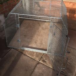Dog cage with escape hatch idea for estate or van measurements are 43”wide 27”high depth 38” bottom 28” top Fantastic Condition only selling as not used