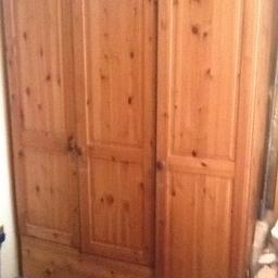 Lovely pine wardrobe with shelving and a drawer. Measures Depth 22 1/2 " - width 50 1/2 " and Height 73"- all in fair condition with few scatches here and there but as its all solid wood can be re waxed or polished out easily . Wardrobe will be dismantled for easier collection
