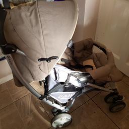 used but it has been washed as all covers are removable and ready to be used again. 

comes with matching car seat.
