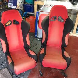2 high back rally style car seats, some fading due to the sun, may dye, hence price