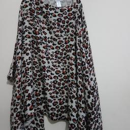 BRAND NEW with tags from NEXT. This beautiful cover up is light weight and designer and the same time. It's got a great look to it and a soft feel ideal for the spring season ahead. Can be worn indoor and outdoor. Can be worn casual or for a special event. Animal print with pink colour here and there to make it unique.