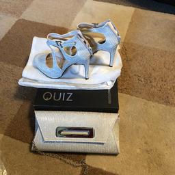 Quiz silver heels size 4 and matching bag. Bought and worn once for wedding function. Scuff on one heel as shown