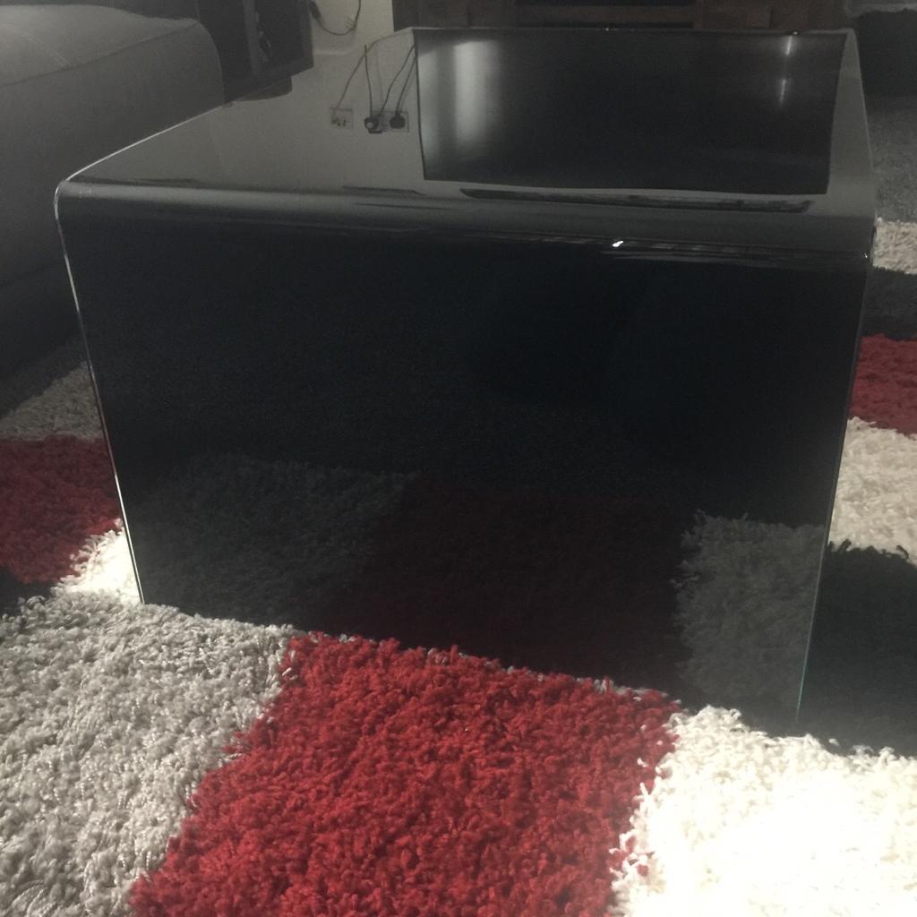 Curved black glass coffee table in S65 Rotherham for £50.00 for sale
