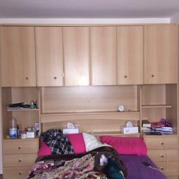 4 compartments with two sliding doors and two normal doors. 3 drawers on each side comes with lighting. Bed frame included. Very good condition/ no damage. MUST GO SOON.