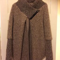 Only worn once. Has zip and button fastening. Light brown and grey. Great for the cold.