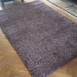 Dunelm rug in good condition out of bedroom. 140 x 200 size.colour heather