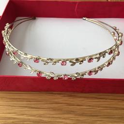 Beautiful pink crystal flower design metal adult headband in good condition with pink box.