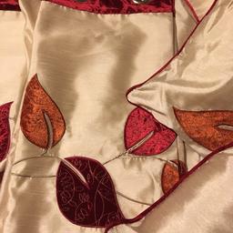 46across 90 down
Cream curtains with red and orange trimming and with leaf design