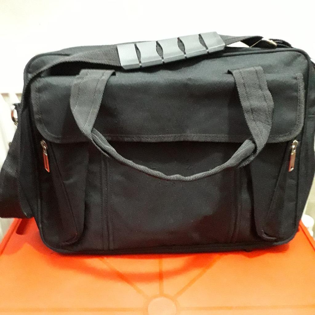 SHOULDER STRAP AND HANDLES. FRONT POCKET WITH ZIP. 2ND. FRONT POCKET WITH ZIP WITH FLAP. EX. LARGE INTERIOR POCKET WITH ZIP. BACK POCKET HAS SLIDE IN COMPARTMENT. HAS A STRIP FULLED WITH ANTI MOISTURE BEADS. ZIP CLOSURE. HAS VELCO STRAP AT BACK WHICH OPENS UP TO FIT HANDLE OF WHEELY LUGGAGE. HEIGHT 31 CM. LENGHT 40 CM. HAS A NEW BABIES CHANGING MAT IF REQUIRED. LOVELY BAG. CAN POST FOR COST OF POSTAGE IF REQUIRED.
