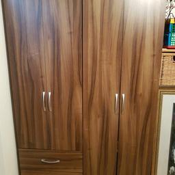 Wardrobes walnut colour
1 with hanging rail n drawers
1 with hanging rail n shelf