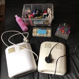 2 UV lights fully working , box of tips , box of nail vanishes that have barely been used and nail art varnish also practice nail stand which has on a few of them some designs done on with nail varnish easily removed by varnish remover !! That is another thing which is also included !! 👍