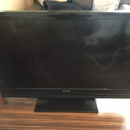 A Sony Bravia 40" HD TV in perfect working condition with controller and power cable.