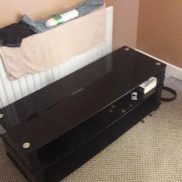 Glass tv /coffee table for sale has a few minor scatches. no longer needed. Collection only