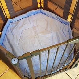 Well used playpen with gate.
Has tear in one of the sides but still does the job.  Blue fabric mat included.