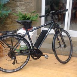 Cube Travel professionally converted using a Bafang 250w mid-drive motor and a Li-Lon Rocket 36v 10.4Ah battery. The bike was £1499 when new, I purchased it 40 miles later. It has now done 60 ish miles (see pics) and is in fantastic condition. 9 speed shimano deore gears. Fitted with rack, mudguards and integrated lights. Superb bike, unfortunately not the right size for me. Pic shows bike set up for 5'8" rider.
 to view identical bike see the 'eBike Sales' YouTube Cube Travel conversion video
