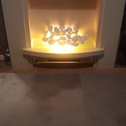 Nice electric fire with white pebbles on a glass shelf ..when switched on its like a flame effect..a few knocks and marks nothing major £50 onto Moira area