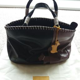 Very well loved radley bag. Comes with dust bag