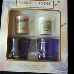 Yankee Candle gift set.  2 votive  candles - fragrance pink sands and white gardenia.  2 votive holders.