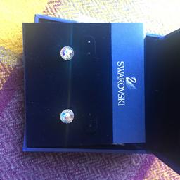 Genuine Swarovski earrings, never worn
Small round studs 
Recorded delivery available but at an additional cost-please ask for more