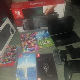 here iv got a nintendo switch only been played a few times and now packed back in its box. this is what you get.

games:
super mario odyssey
rime
skyrim
mariokart 8 deluxe
zelda

brand new nintendo switch carrying case and screen protector

nintendo switch pro controller