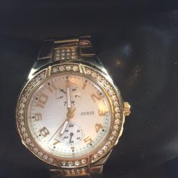 Beautiful bejewelled gold coloured watch. Unwanted gift bracelet has had one link removed to fit my wrist however link is in the box. Comes with original box. Does need battery. Worn once