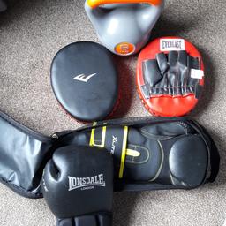 Boxing gloves,sparing pads and a 6kg weight for sale.