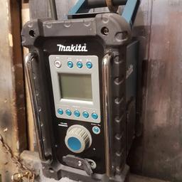 Hi and welcome to the auction of my Makita BMR100 site radio.

This is a used and it's in great condition and works perfect 

It takes Makita lithium ion batteries along with the old school Ni-Cd "red" and Ni-MH "black" rechargeable batteries.  

It has a mains power supply port on the front the power supply included in this sale 

PLEASE NOTE: BATTERY AND AC ADAPTER IS NOT INCLUDED IN THE SALE 

The radio also has a Auxilary input in case you wish to connect your iPod, iPhone or other devic