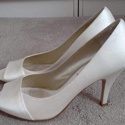 Ivory shoes Size 7 warn once for a wedding.