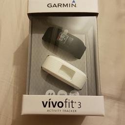Garmin Vivofit 3 activity tracker. Unwanted present. Never used. Comes with white and black wrist straps.