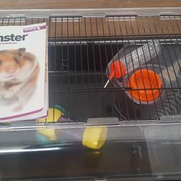 Used hamster cage. Does have the usual urine marks in but won't be seen when the sawdust is in. Comes with see saw/ book/dish/bottle (missing wire For bottle)