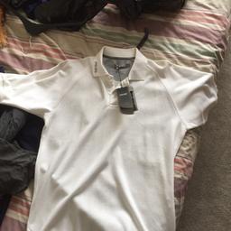 Ping golf t shirt never worn still with tag. It’s a big small