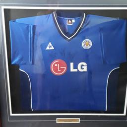 Leicester City Framed Football Shirt, WITH SIGNATURES from 2004 - 2005. Unfortunately we have nowhere to hang it, so it has to go.
Photo's have a bit of a glare, as it's under glass, but absolutely fine when you see it.
Fantastic gift for a LCFC fan.

-GIVE ME A PRICE - OPEN TO OFFERS