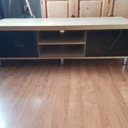 TV Video Cabinet Stand
Beech Effect 
3 Compartments With Sliding Glass Doors 
Small Part Lofting at Back Which Will Stick Down
Otherwise Excellent Condition
Length 58"
Depth 21.5"
Height 17"