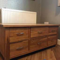 This is a coffee table with a six drawer system beneath that run either side of the table.
Table dimensions 575mm by 1155mm by 485mm high.
Table needs re oiling but is in very good condition.