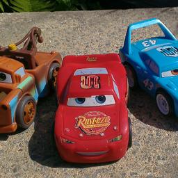 Lightning McQueen, Mater, Dinoco.
Used.