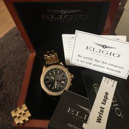Eligio mans 18ct gold diamond watch , never been worn, comes in box , beautiful watch ,