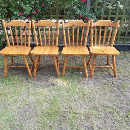 4 solid wood chairs, few scratches due to age as seen in the picture, but all are in good working condition