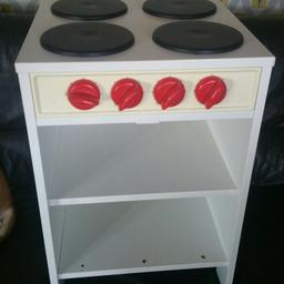Toy oven. Unfortunately the door is missing. Could be upcycled or used as a kids bedside cabinet. Very sturdy. It has mirrors on the side. W 40cm x D 39cm x H 60cm.
