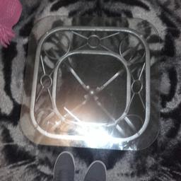 A small four legged coffee table about 40cm high. Got a few marks/finger prints but can easily be cleaned off. No chips or cracks on glass also the glass can be removed easily to allow for storage or cleaning.