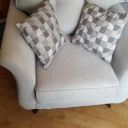 We have here a lovely 2 seater sofa and chair with contrasting cushions. Never been used
 Been in storage since we purchased it.