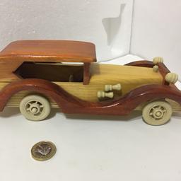Wooden display model of a classic car hand assembled.