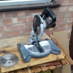 Cordless chop saw 2 24v batteries and charger 1 spare cutting blade cuts 45 degree mitres and straight cuts portable of red bench mounted pick up or can drop off local