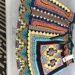 African print multicoloured Mini Skirt. Size 16. Never worn, good as new with label. Good essential for holiday.